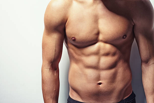 Muscular torso of young man stock photo