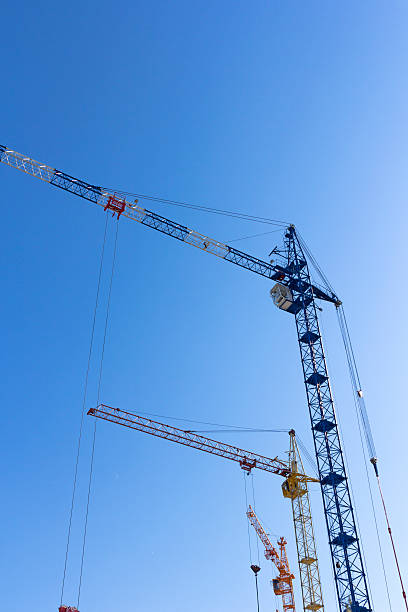 istock Industrial landscape, building crane against the blue sky 497572518
