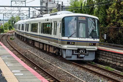 Kyoto, Japan - August 13, 2015: A Japan Railways Miyakoji Rapid service operated by a series 221 train