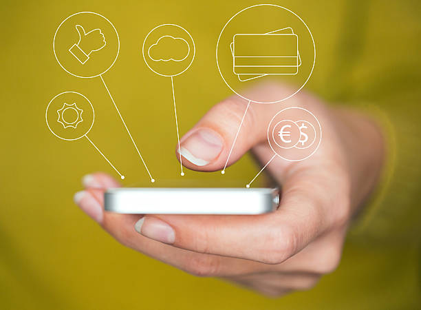 istock Hand holding smartphone with  icons and symbols concept 497574948