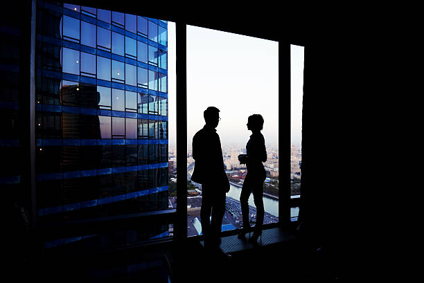 istock Successful man and woman office workers discuss ideas during break 497575096