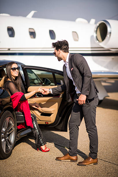 istock Gentleman helping a woman to exit the car 497575430