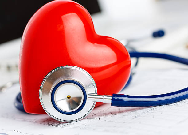 istock Medical stethoscope head and red toy heart 497576856