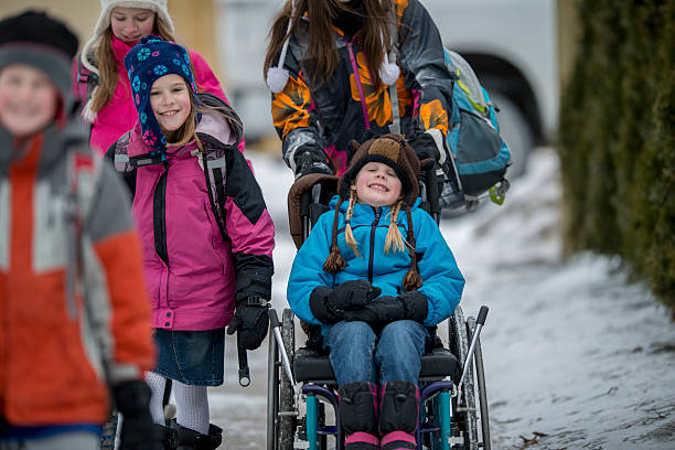 istock Girl Being Pushed in a Wheelchair 497577008