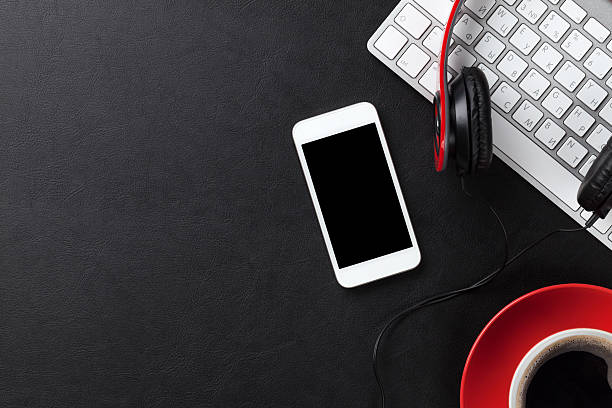 istock Office leather desk with pc, smartphone and coffee cup 497577898