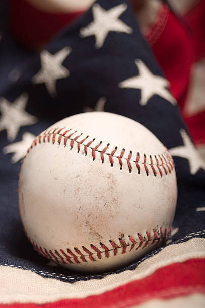 istock Baseball on an American flag 497583305