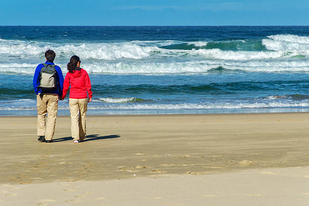 istock Happy couple on beautiful ocean beach 497584495