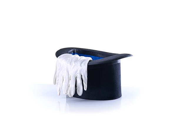 istock Black magician top hat with a pair of white gloves 497589069