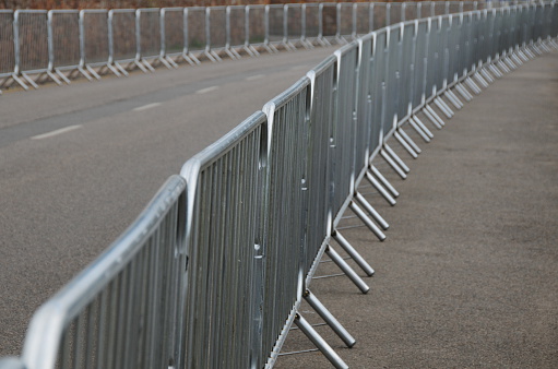 New metal barrier's on an empty road.
