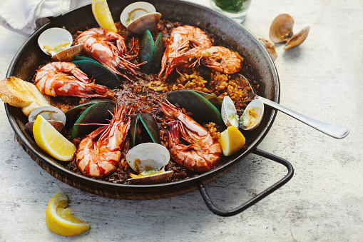 Spain's national dish paella with prawns, cuttlefish, clams and mussels.