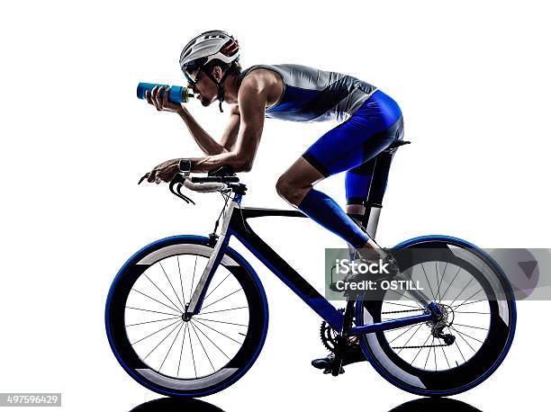 Iron Man Bicyclist Drinking Water While On Bike Stock Photo - Download Image Now - Cycling, Bicycle, Triathlon