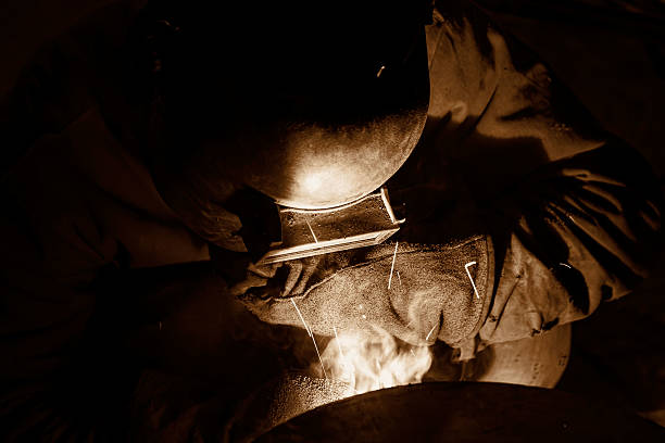 Welder at darkness Welder at darkness - monochrome photograph  oxyacetylene stock pictures, royalty-free photos & images