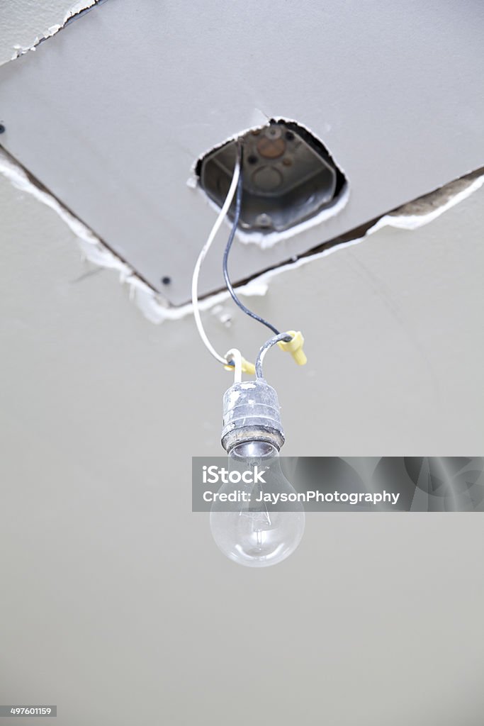 Installation of lightbulb / LED ceiling light Installation of lightbulb / LED ceiling light during construction  Breaking Stock Photo