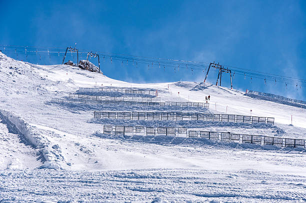 istock Ski lift and snow fences in Austrian Alps 497601902