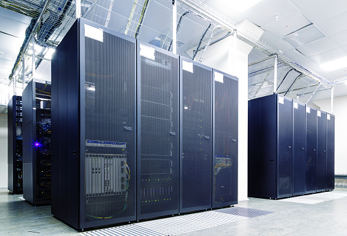 room with rows of server hardware in the data centerroom with rows of server hardware in the data center