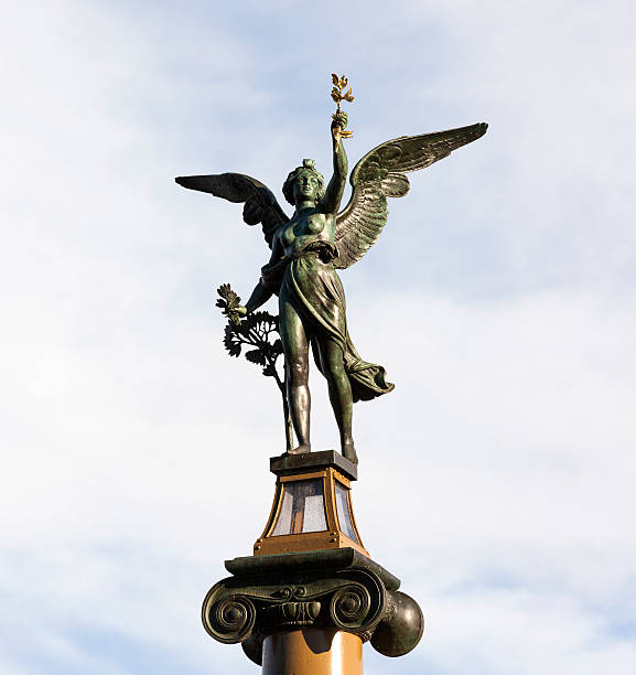 istock The sculptures on the pillars Geniuses Chekhov column. Prague. 497605056