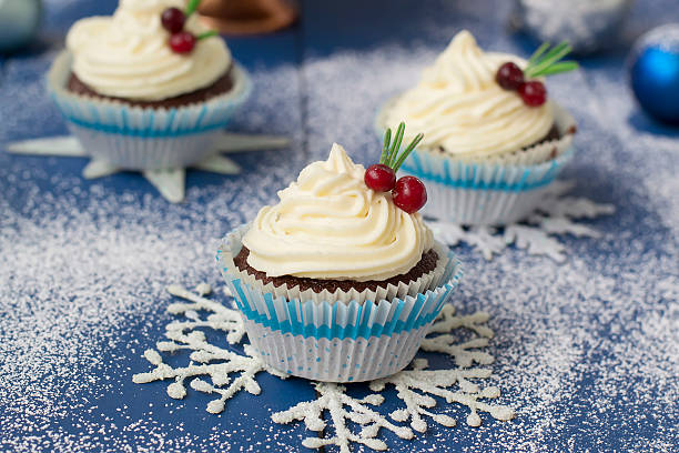 istock Chocolate cupcake with cream cheese in Christmas decorations 497606548
