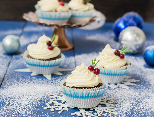 istock Chocolate cupcake with cream cheese in Christmas decorations 497606572