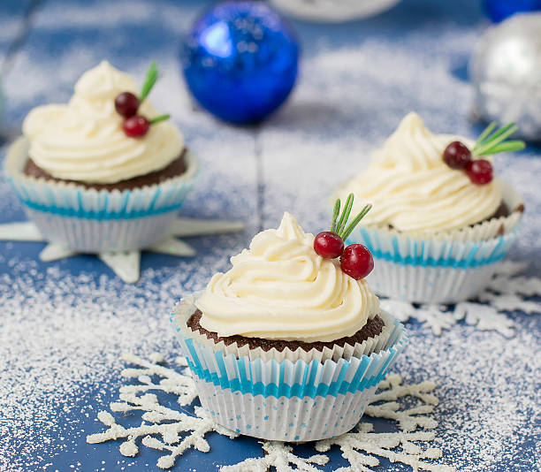 istock Chocolate cupcake with cream cheese in Christmas decorations 497606596