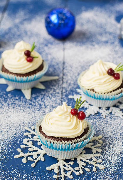 istock Chocolate cupcake with cream cheese in Christmas decorations 497606688