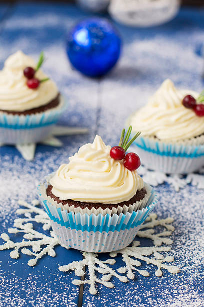 istock Chocolate cupcake with cream cheese in Christmas decorations 497606740