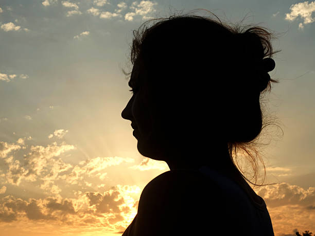 istock Silhouette of young gril in sunlight 497606742