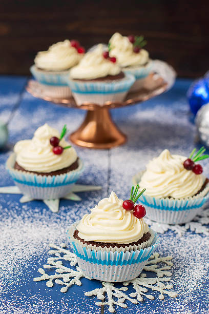 istock Chocolate cupcake with cream cheese in Christmas decorations 497606772