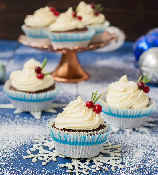 istock Chocolate cupcake with cream cheese in Christmas decorations 497606800