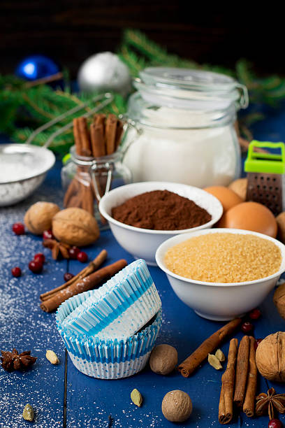 istock Ingredients for baking Christmas muffins on wooden background. s 497607342