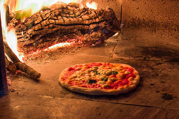 Margherita pizza in a wood oven Pizza in a traditional wood oven Italian naples italy photos stock pictures, royalty-free photos & images