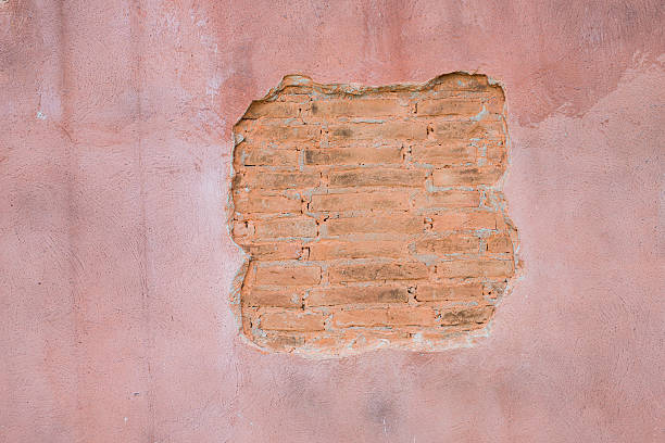 istock cracked concrete vintage brick wall background.with space for text 497608896