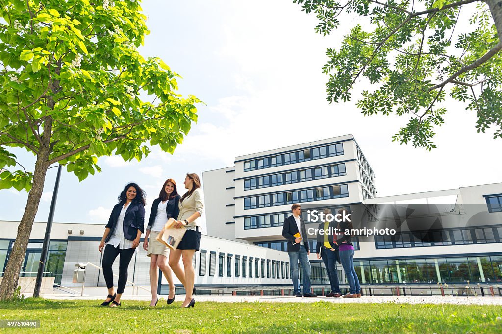 group of students on campus students outdoors on university campus in summer Campus Stock Photo