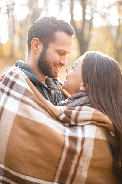istock Nice concept for young couple in autumn park 497611598