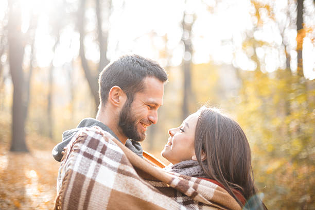 istock Nice concept for young couple in autumn park 497611684