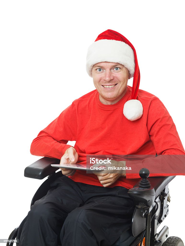 Santa holding a digital tablet Disabled Santa claus with digital tablet Using Digital Tablet Stock Photo