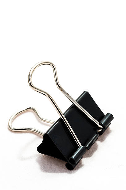 istock Black paperclip in white background 497612857