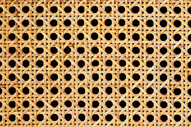 Rattan weave Closeup of rattan weave isolated on black background interlace format stock pictures, royalty-free photos & images