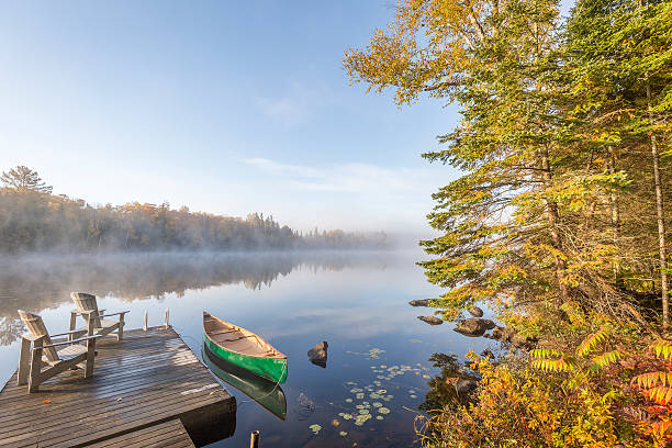 istock Canoe Tied to a Dock at Dawn 497614278