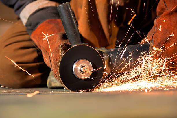 Grinding with sparks cutting with grinder in the workshop - blurred motion oxyacetylene stock pictures, royalty-free photos & images
