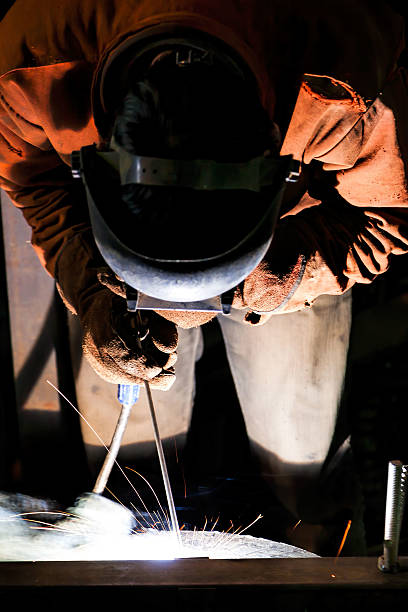 Welder's special tecnique Welding metal pipe oxyacetylene stock pictures, royalty-free photos & images