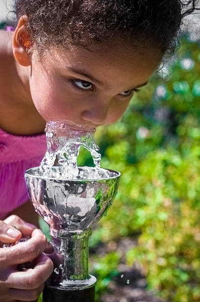 istock PEOPLE: Child (4-5) Drinking Water From Fountain 497616105