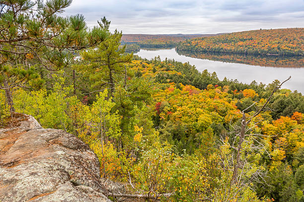 istock Precambrian Rock Overlooking Fall Colors and a Lake 497616238