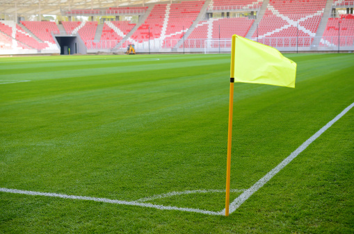 Yellow corner flag on an soccer field