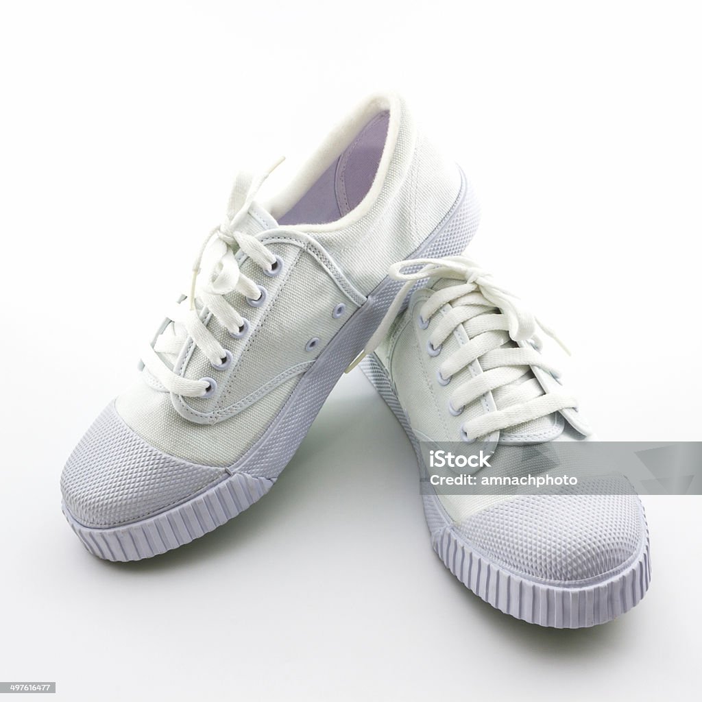 Branco os sapatos de desporto em fundo branco. - Royalty-free Adulto Foto de stock