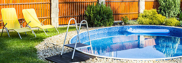 istock panorama of small home swimming pool 497619537