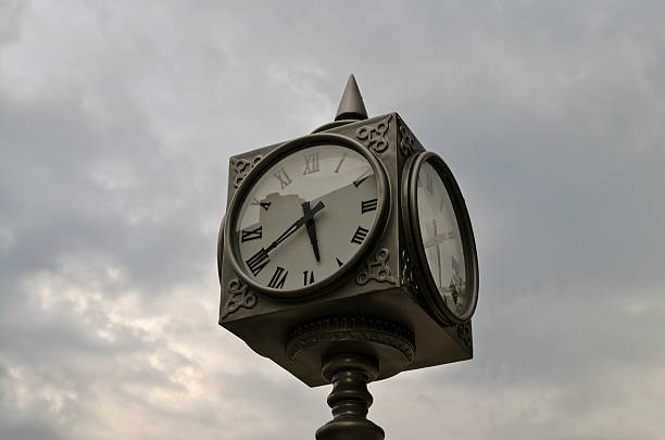 istock Big street Clock on the blurred sky background 497627570