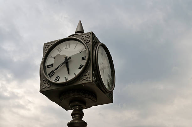 istock Big street Clock on the blurred sky background 497627582