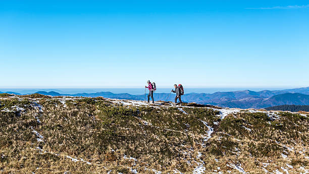 istock walking couple in carpathian mountains 497628230