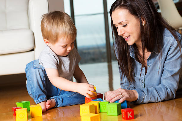 istock mother play block with his son at home 497629290