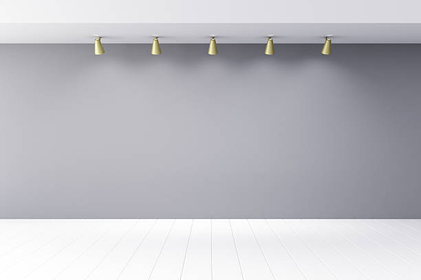 istock Empty room withgrey wall with lapms and white wood floor 497630232